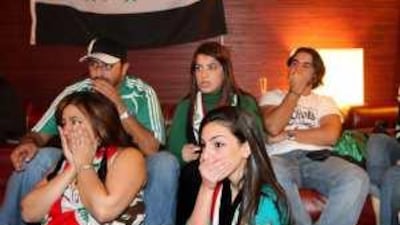 Anquish on the faces of Iraq football fans watching the Iraq v Bahrain game in a cafe on the Corniche.