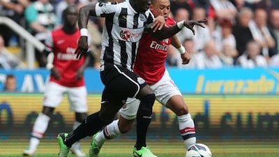 Alex Oxlade-Chamberlain, right, said Arsenal were right to celebrate after beating Newcastle City given how Uefa Champions League qualification is difficult these days. Ian MacNicol / AFP