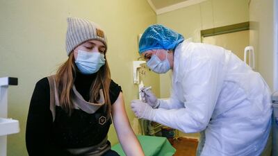A young woman receives the Sputnik V Covid-19 vaccine in the pro-Russian militant-controlled territory of Ukraine. EPA