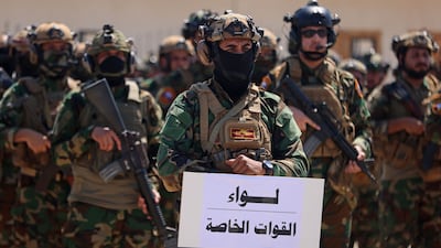Members of Saraya Al Salam gather during a ceremony in the city of Samarra, marking their separation from the Sadrist movement and their integration into the Iraqi security forces. AFP