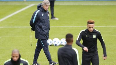 Manuel Pellegrini watches his players during training on the eve of the game against Juventus. Ed Sykes / Reuters