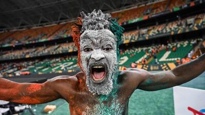 An Ivorian supporter celebrates. AFP