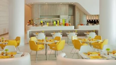 With cheerful splashes of colour, the interior of Origins makes an agreeable environment for an informal meal. The dessert counter (right) features an extensive choice of rolls, pastries and tarts as well as fresh fruit. Courtesy Origins at Yas Viceroy