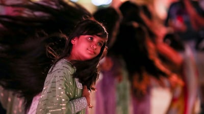 Emirati girls perform the raqs sha'ar, or hair dance, at Al Hosn Festival in 2021. All photos: Khushnum Bhandari / The National
