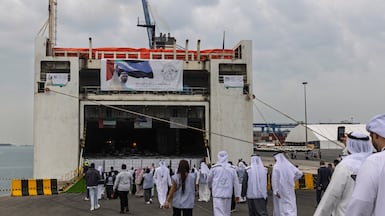 The vessel, laden with supplies, prepares to leave Khalifa Port. Antonie Robertson / The National