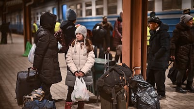 People arrive on an evening train from Ukraine to Przemysl, Poland, after fleeing the country at war with Russia. Getty
