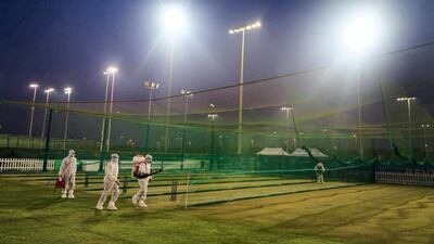Workers in PPE disinfecting the practice area at Abu Dhabi Cricket in order for Mumbai Indians and Kolkata Knight Riders to train ahead of the IPL. Courtesy Abu Dhabi Cricket