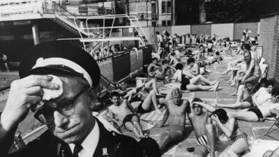 An ambulance man on duty at the Holborn Oasis swimming pool in London, in 1964.