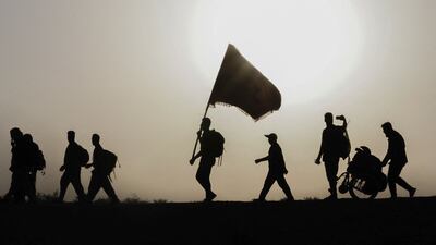 Iraqi and Iranian Shiite pilgrims walk from Najaf to Karbala to take part in the Arbaeen religious festival. AFP