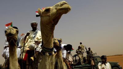 Supporters of Lieutenant General Mohamed Hamdan Dagalo, deputy head of the military council and head of paramilitary Rapid Support Forces (RSF), sit on their camels as they await his arrival at a meeting. Reuters