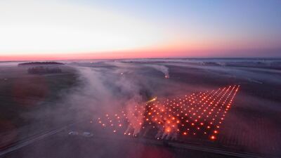 Fires are set in the Vouvray vineyards, a method to protect vines and grapes from frost, near Vernou-sur-Brenne, central France. AFP