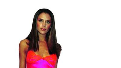 2. Later Spice Girls years: As the world embraced the new millennium, Victoria, who married English footballer David Beckham in 1999, started to embrace a new look. She became increasingly fond of black and started to develop her now-famous pose. This pink Rebecca Davis top and skirt (pictured right), which sold for £656 (Dh4,009), was worn to the VH1 Vogue Fashion awards in Los Angeles in 2000. George De Sota / Newsmakers