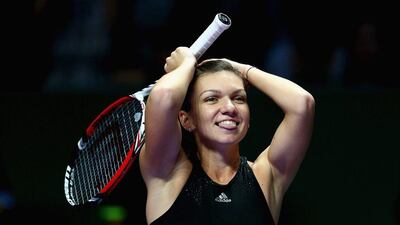 Simona Halep reacts after beating Serena Williams in straight sets at the WTA Finals on Wednesday in Singapore. Clive Brunskill / Getty Images / October 22, 2014