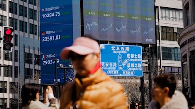 A large screen showing stock exchange and economy data in Shanghai, China. EPA