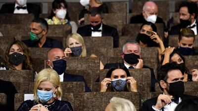 Cate Blanchett, second row left, and Matt Dillon, second row right, wear face masks during the Opening Ceremony. EPA
