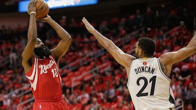 Houston Rockets guard James Harden shoots over Tim Duncan during their NBA contest on Friday. Bob Levey / AP / December 25, 2015
