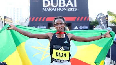 Dera Dida celebrates after winning the Dubai Marathon 2023. Getty