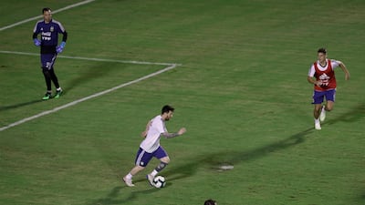 Messi makes a run with the ball during training in Salvador. AP Photo