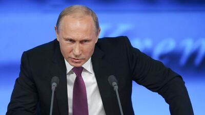 The Russian president Vladimir Putin speaks at his annual end-of-year news conference in Moscow on December 18, 2014.