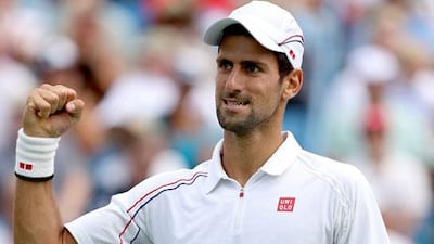 Novak Djokovic celebrates scoring a point against Juan Martin Del Potro at the Western & Southern Open semi-final