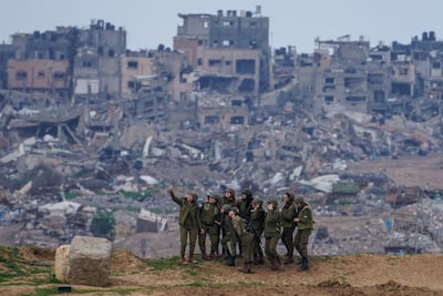Female Israeli soldiers pose for a selfie at a position on the Gaza border. AP