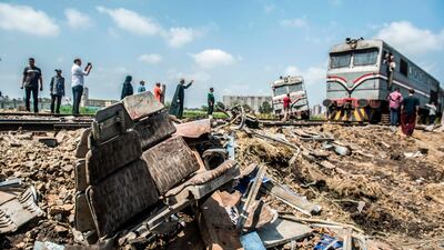 A train passes by the site of the fatal collision in Khorshid, on the outskirts of Alexandria, on August 12, 2017. Khaled Desouki / AFP
