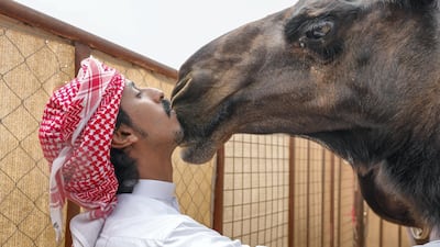 Hamed Jaber Al Jilab, 23, and Sleema Senior, 7, at the Al Dhafra Festival. Victor Besa / The National