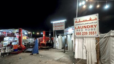 Red Robe Laundry is one of the businesses run out of a tent on Millions Street at the Al Dhafra Festival, Abu Dhabi. Victor Besa / The National