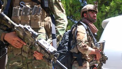 Afghan security officials arrive as part of a reinforcement to fight against Taliban militants as they push to gain access to the city in Herat.