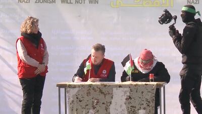 Paperwork is signed for the release of Keith Siegel in Gaza. Screengrab Sky News Arabia