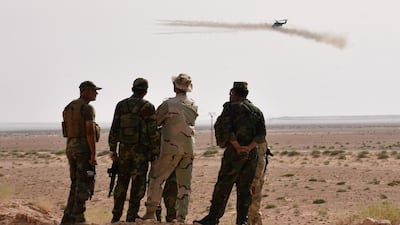 Syrian government forces on the outskirts of Deir Ezzor, where they continue to engage in a battle against ISIL. George Ourfalian / AFP