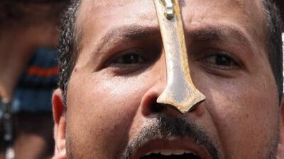 Egyptian Christians protest in front of the state television building in Cairo yesterday, a day after fresh clashes with Muslims left 78 injured.