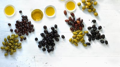 A selection of olives and olive oils. Dorling Kindersley / Getty Images