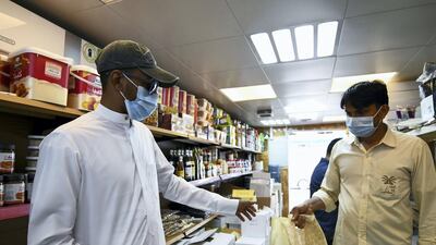 Ahmad Idris buying his dates at Royal Dates in the Mina market. Khushnum Bhandari for The National