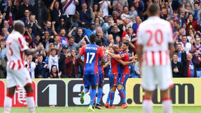 Andros Townsend of Crystal Palace, left, celebrates scoring his side’s fourth goal with Joel Ward against Stoke City on Sunday. Warren Little/ Getty Images