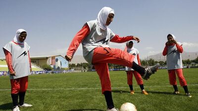 The International Football Association Board and Fifa have agreed to lift a ban on religious head coverings, opening up more opportunities for Muslim women to play football. Amir Poormand / ISNA / AFP