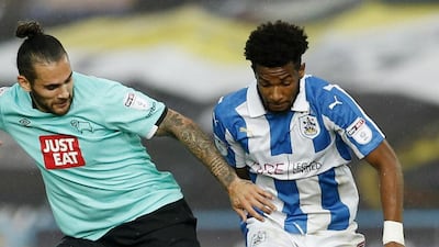 Kasey Palmer of Huddersfield Town battles Bradley Johnson of Derby County during their match last week. Andrew Boyers / Action Images