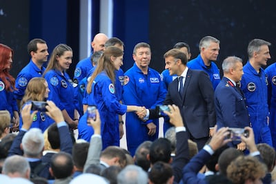 Emmanuel Macron meets astronauts during the International Space Summit in Paris. EPA