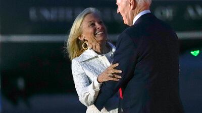 He embraces Ms Hartley on his arrival. AP