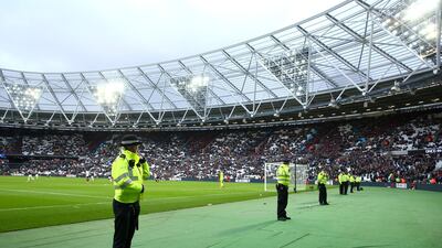 Police look on at the fans after the Premier League match between West Ham United and Burnley at London Stadium on March 10, 2018 in London. Jordan Mansfield / Getty Images