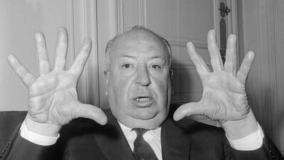 British film director Alfred Hitchcock gestures as he gives a press conference in Paris to present his last movie "Psycho" in 1960.