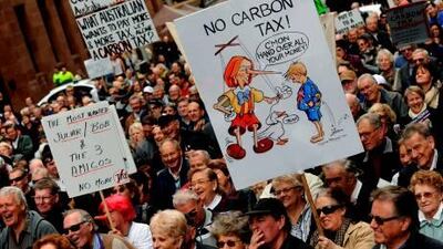 A protester holds a placard during a rally in Sydney against Australian prime minister Julia Gillard's planned carbon tax.