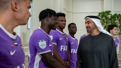 Sheikh Mohamed shakes hands with Al Ain's players