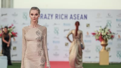 Fashion by Filipino designers Jose and Aldwin Guardiana.