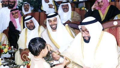 Sheikh Zayed with Sheikh Mansour bin Zayed and Sheikh Zayed bin Mansour at the conclusion of the Arabian Horse Festival in March 2000.