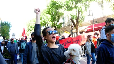 Tunisian demonstrators clash with law enforcement officers during a protest against police brutality and the last cabinet reshuffle in Tunis. AP