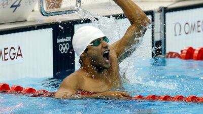 Amro El Geziry from Egypt celebrates after winning the swimming competition as part of the modern pentathlon. Michael Sohn/AP Photo
