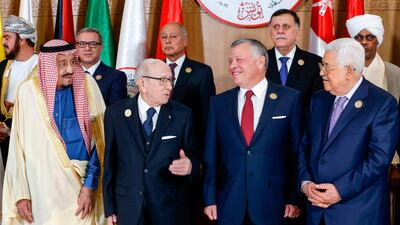 Tunisian President Beji Caid Essebsi (second left) speaks with Jordan's King Abdullah II (second right) as they stand between Saudi Arabia's King Salman bin Abdulaziz (left) and Palestinian president Mahmoud Abbas (right) during the 30th Arab League summit in the Tunisian capital Tunis. AFP