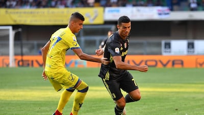 Cristiano Ronaldo outruns Chievo's midfielder Fabio Depaoli. AFP