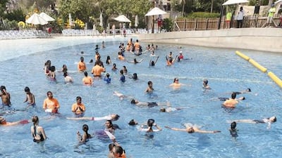 Children at Dubai’s Wild Wadi take part in a world record attempt for the largest global swimming class. Antonie Robertson / The National
